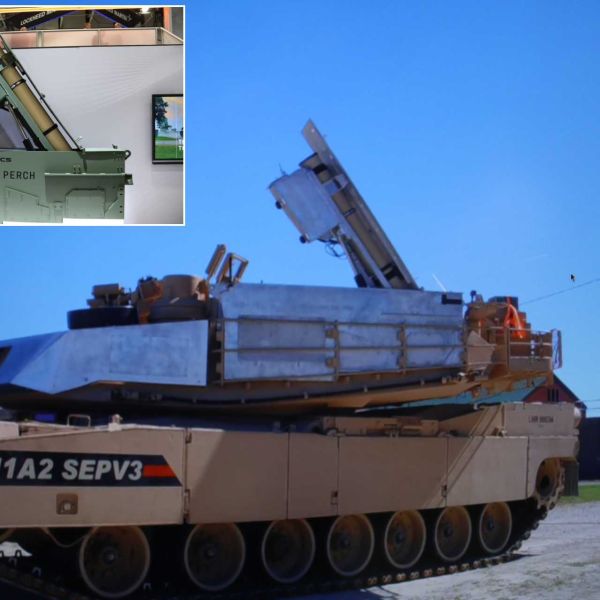 PERCH loitering munition launcher integrated on a U.S. Army M1A2 Abrams SEPv3, demonstrated by General Dynamics Land Systems at AUSA 2025, showcasing new over-the-horizon strike capability without modifying the tank’s structure.
