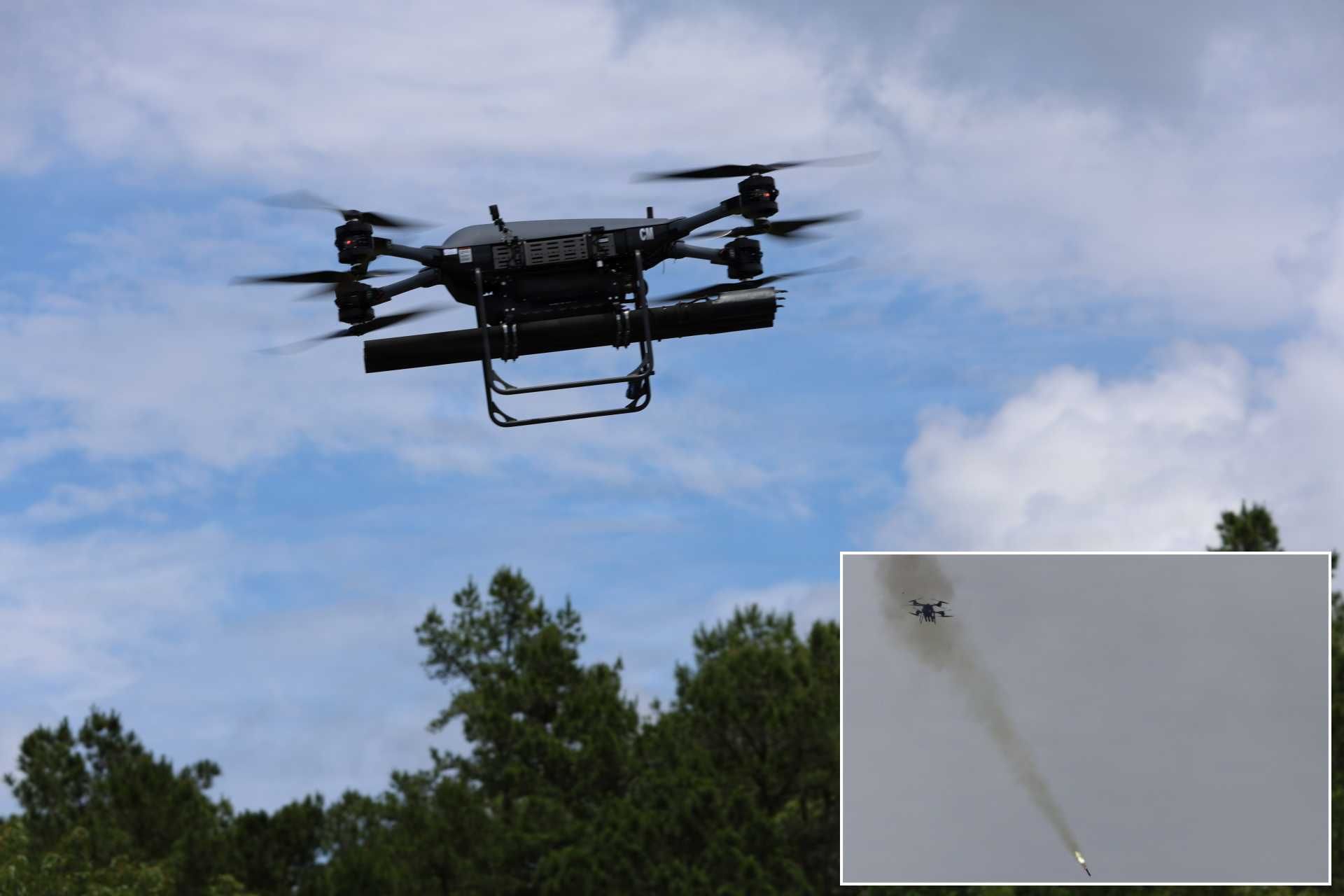 TRV-150 tactical resupply drone armed with a three-shot APKWS launcher launches a laser-guided 70 mm rocket during flight testing at Fort Rucker, Alabama, on May 20, 2026, demonstrating a new battalion-level precision-strike capability.