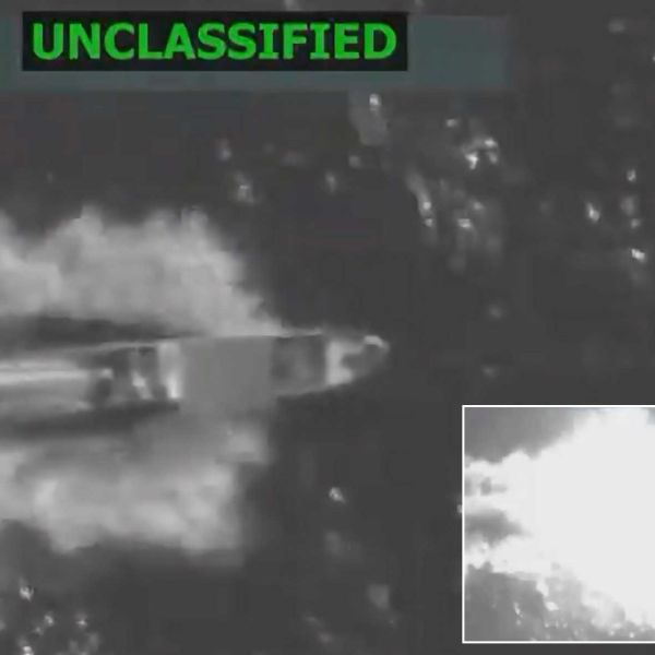 Still from U.S. Department of War-released footage shows the moment of impact as a precision-guided munition strikes a suspected drug trafficking vessel in the eastern Pacific, October 23, 2025.