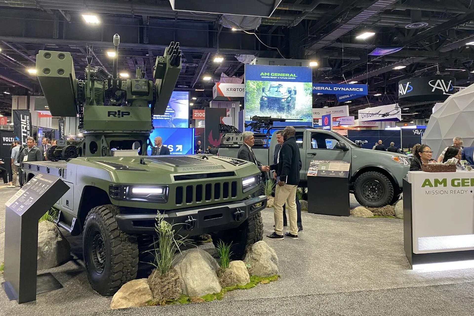 AM General’s combat-ready UGV displayed at Modern Day Marine integrates a Moog RIwP remote turret with 30 mm gun and missile options, giving Marines an autonomous vehicle for resupply, reconnaissance, counter-drone defense, and high-risk missions in contested environments (Picture source: AM General).