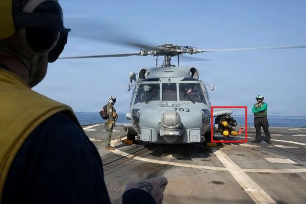 A U.S. Navy MH-60R Seahawk armed with Hellfire missiles was photographed operating from the destroyer USS Delbert D. Black during Operation Epic Fury, highlighting the Navy’s expanded airborne strike capability against small maritime threats in the CENTCOM region (Picture Source: U.S. Navy)