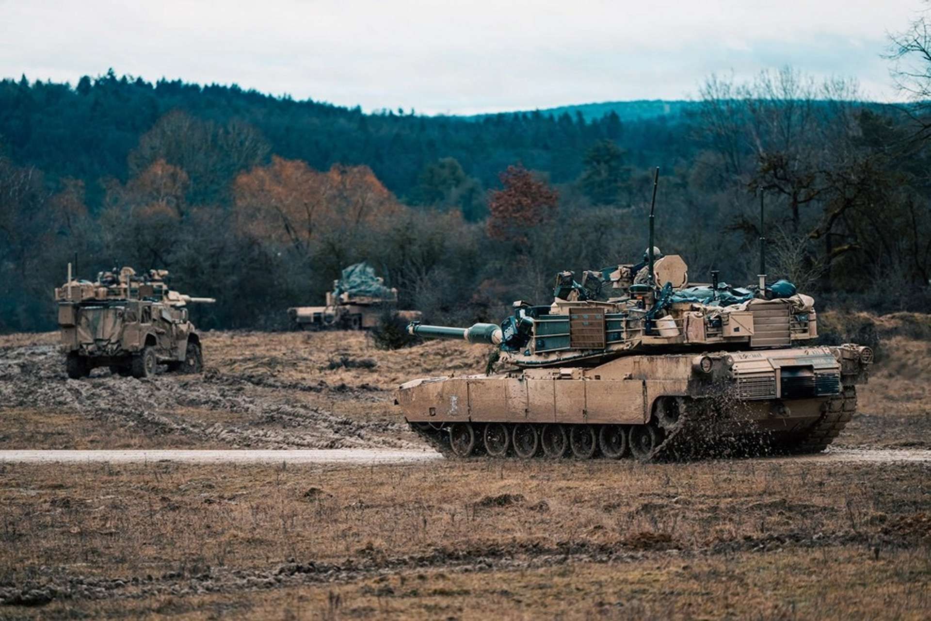 An M1A2 Abrams main battle tank maneuvers during NATO’s Combined Resolve 26-05 at Hohenfels, Germany, where U.S. armored forces and allies rehearse high-intensity combined arms operations to prove rapid reinforcement, interoperability, and credible deterrence on Europe’s eastern flank (Picture source: U.S. DoW).
