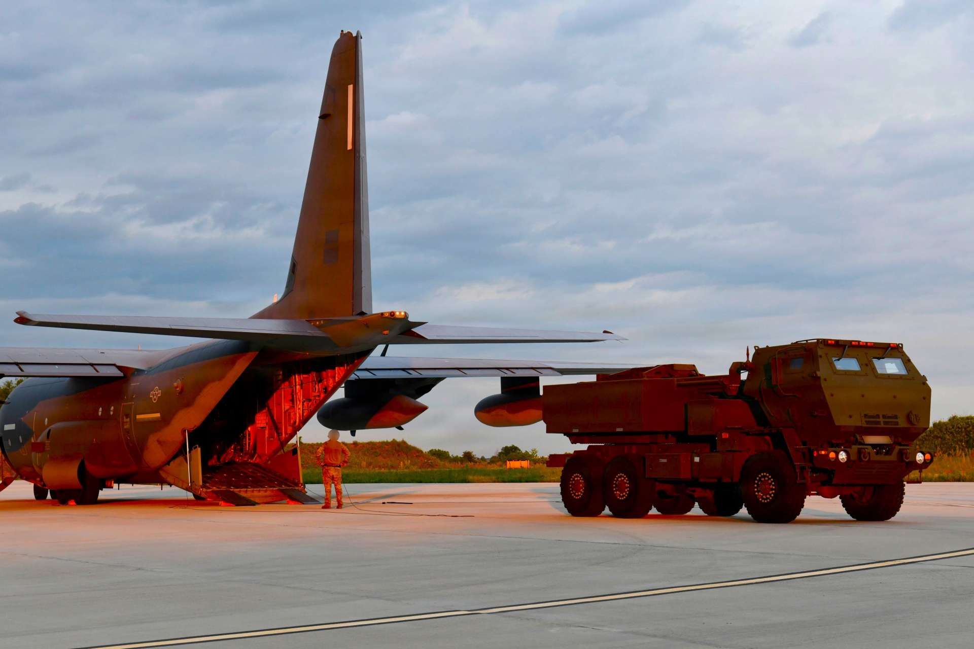 A newly released image showing a Romanian HIMARS launcher being loaded into a U.S. Air Force MC-130J Commando II during Exercise Trojan Footprint 26 highlights NATO's growing ability to rapidly deploy long-range precision fire assets across its eastern flank (Picture Source: U.S. Air Force) 