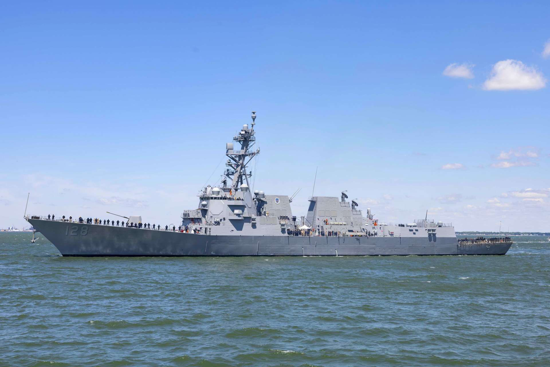 The future USS Ted Stevens (DDG-128) arrived at Naval Station Norfolk as the U.S. Navy expands its next-generation SPY-6-equipped destroyer fleet to replace retiring Ticonderoga-class cruisers in carrier strike group air-and-missile defense roles (Picture Source: U.S. Navy)