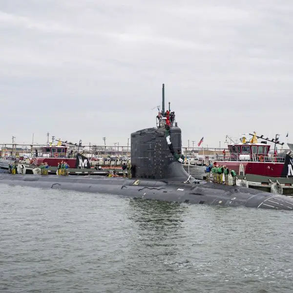 The installed component is a copper-nickel flange, a critical element typically used in critical piping systems and structural interfaces within submarines, where it must withstand high pressure, corrosion, and continuous operational stress. (Picture source: U.S. Navy)