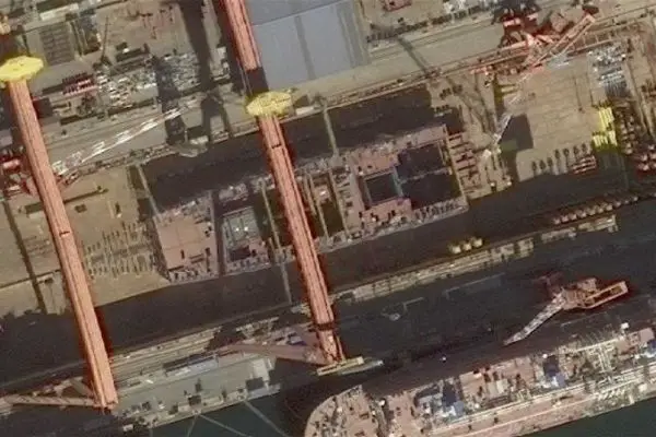 Satellite image published in December 2025 by PLA Military Updates on X shows China’s Type 004 nuclear aircraft carrier under construction at Dalian, with an estimated displacement of 110,000 to 120,000 tons and sea trials projected between mid-2028 and early 2029.