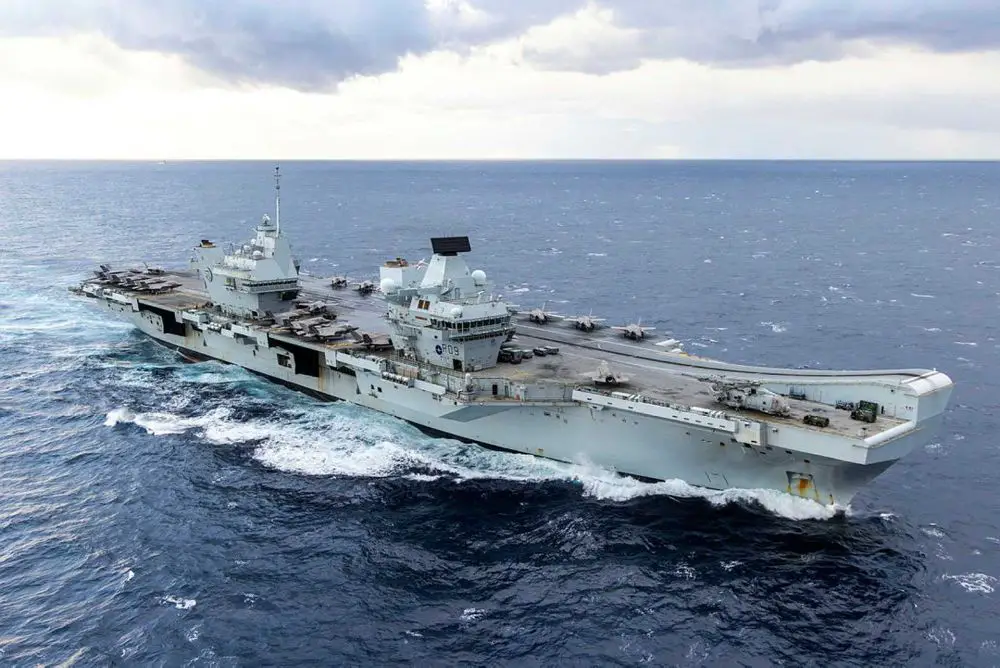 HMS Prince of Wales, the British Royal Navy’s flagship aircraft carrier, sails during carrier strike operations as the United Kingdom reduces its deployment readiness notice to five days, enabling faster power projection toward the Middle East amid rising regional tensions.