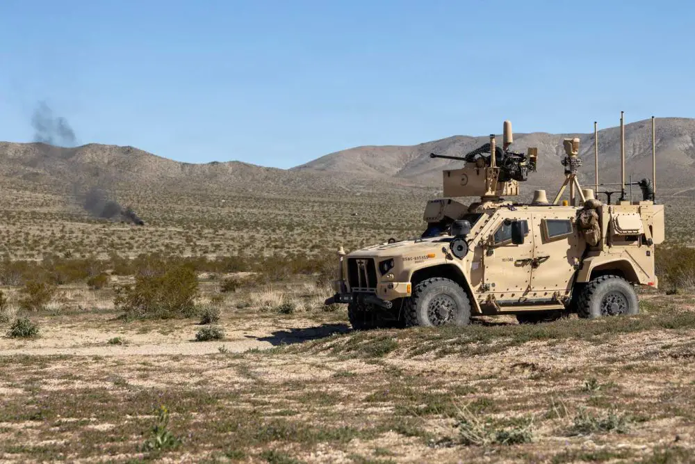 U.S. Marine Corps MADIS JLTV equipped with a 30mm automatic cannon as part of the multi-vehicle Marine Air Defense Integrated System, highlighting its role within a layered, mobile counter-UAS and short-range air defense architecture.