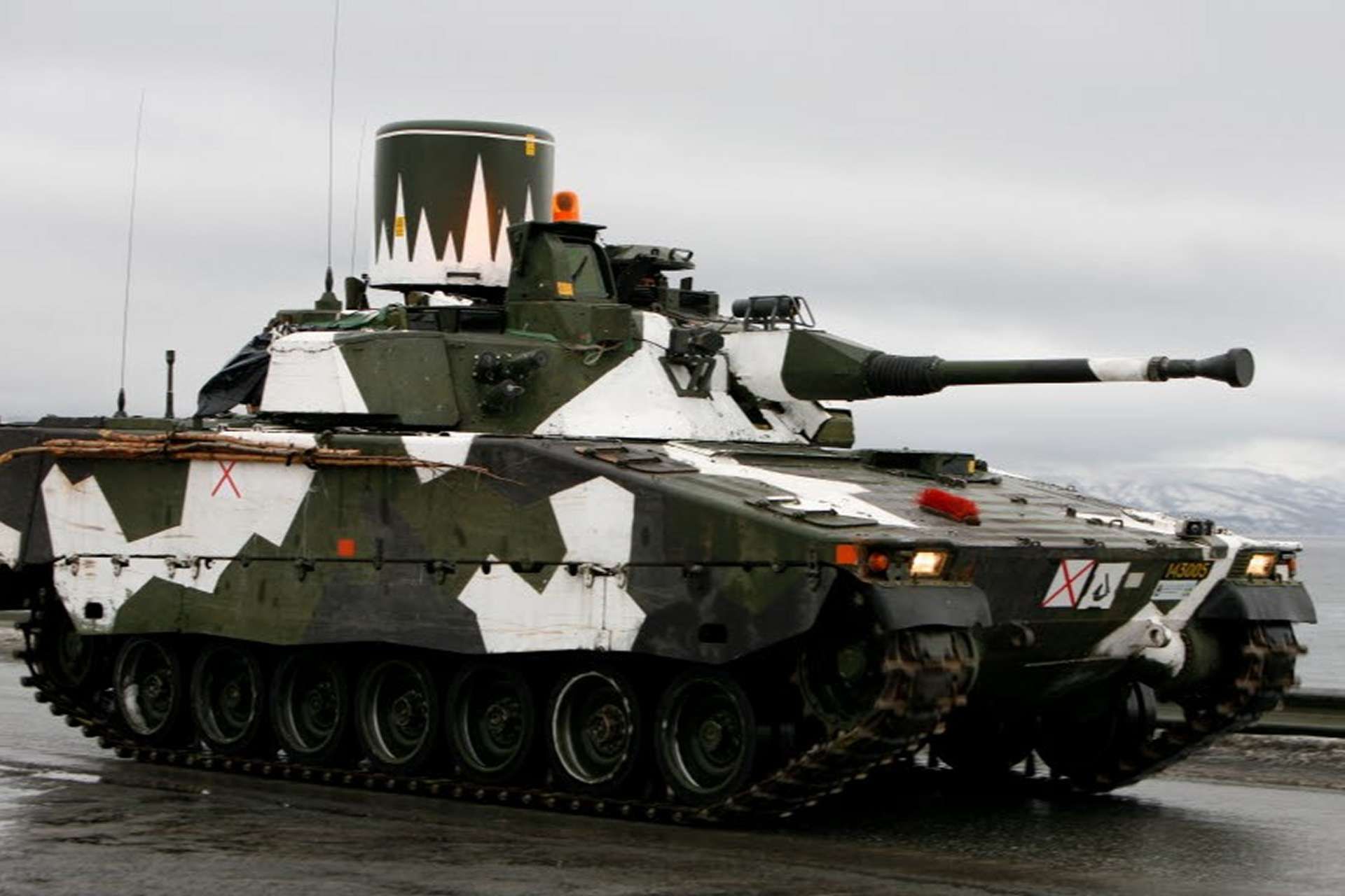 The Lvkv 9040 is a Swedish self-propelled anti-aircraft gun based on the CV90 infantry fighting vehicle, armed with a 40 mm Bofors cannon and advanced radar for targeting low-flying aircraft and drones (Picture Source: Swedish MoD)