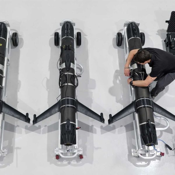 Engineers assemble SG-1 Fathom autonomous underwater gliders at a Helsing Resilience Factory in the UK, showcasing sovereign manufacturing of next-generation maritime surveillance systems for the British Royal Navy.