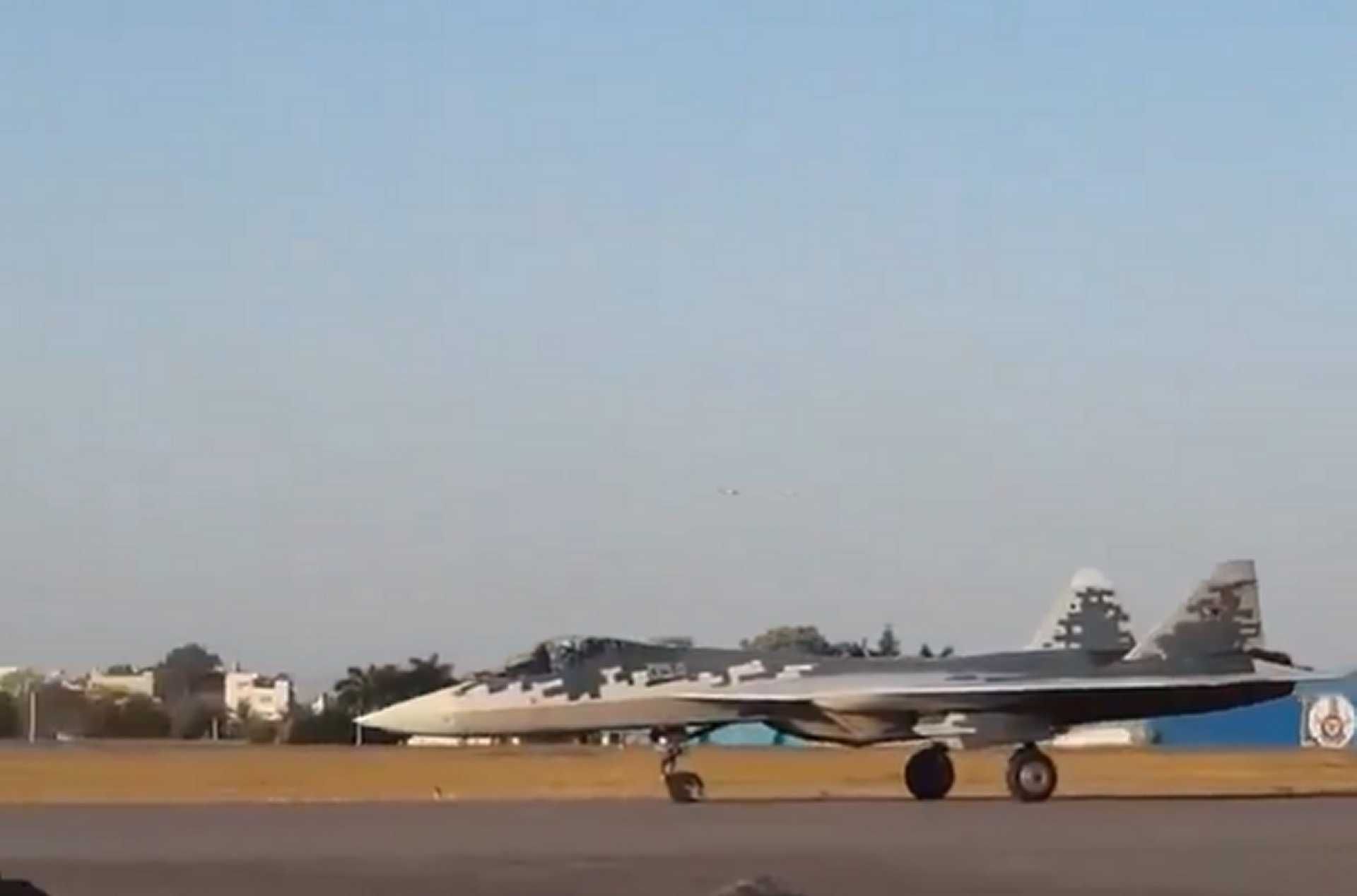 Russian Su-57E fighter jet export variant touching down during a landing demonstration at Aero India 2025, highlighting its advanced airframe and stealth profile.