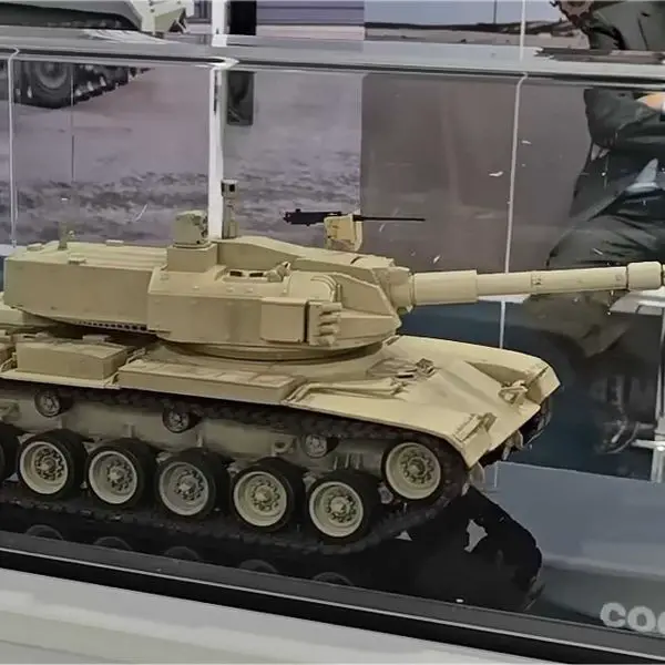Scale model of the upgraded M60 tank featuring the John Cockerill 3105 weapon station on display at the John Cockerill Defense booth during EDEX 2025 in Cairo, Egypt. The concept illustrates a turret-replacement solution to revitalize legacy U.S.-made tanks with modern firepower and digital systems.