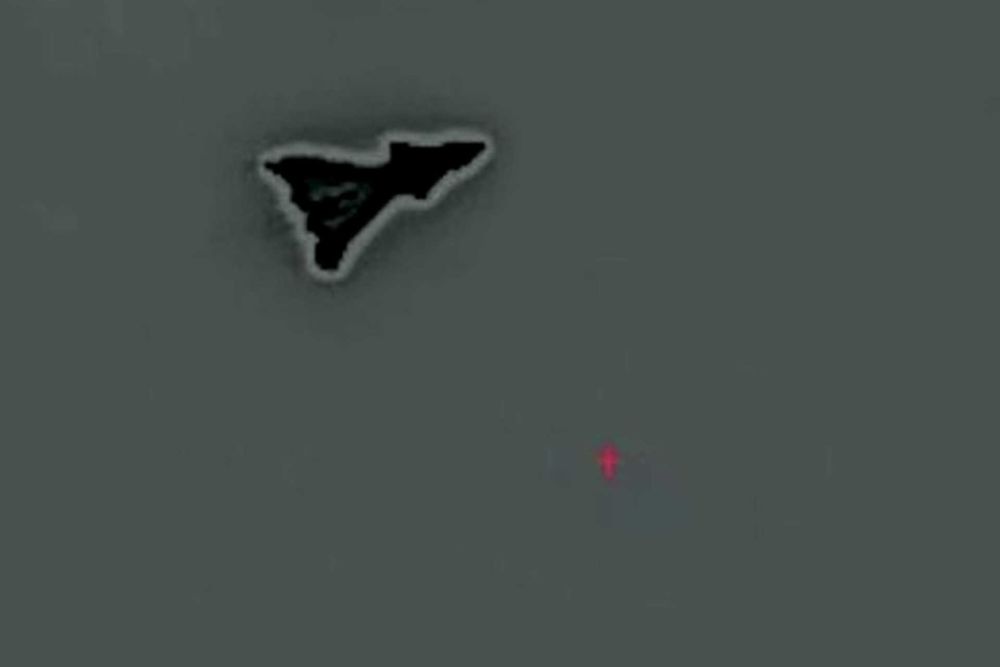 The mysterious aircraft's compact, triangular shape with cranked-kite wings, a sharp nose, possible canards, a sawtooth trailing edge, and no visible vertical tails strongly and strikingly match what is expected of the secretive F-47 fighter. (Picture source: YouTube/Project Fear via X/@OSPSF)