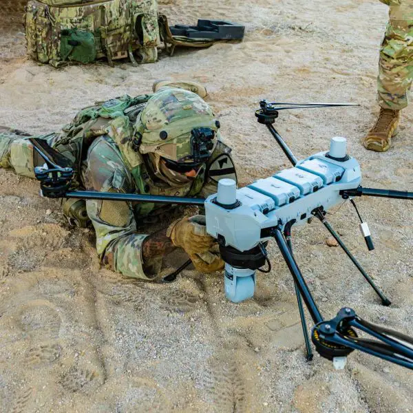 Pfc. Mario Lara, a small unmanned aircraft system operator with 1st Battalion, 8th Cavalry Regiment, 2nd Armored Brigade Combat Team, 1st Cavalry Division, prepares a C100 small UAS for launch during Rotation 26-02 at the National Training Center in Fort Irwin, California, on November 1, 2025.