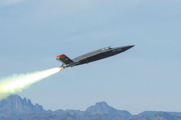 An XQ-58A Valkyrie unmanned aerial vehicle launches at Yuma Proving Ground on Dec. 9, 2020, demonstrating data exchange with F-22 and F-35 aircraft through an open architecture network. (Picture source: U.S Air Force)