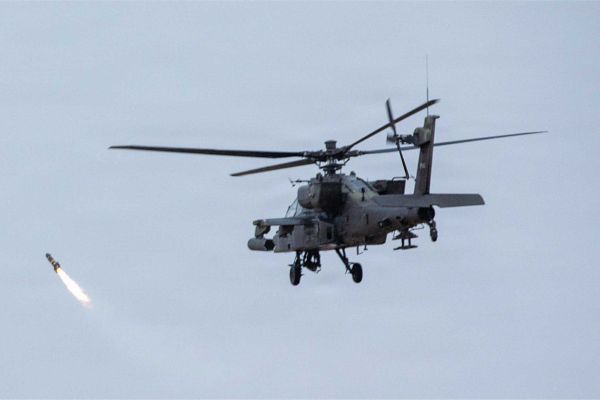A U.S. Army AH-64 Apache operates during a live-fire phase of Exercise Sky Shield at the Udari Range Complex in Kuwait on Dec. 9, 2025.