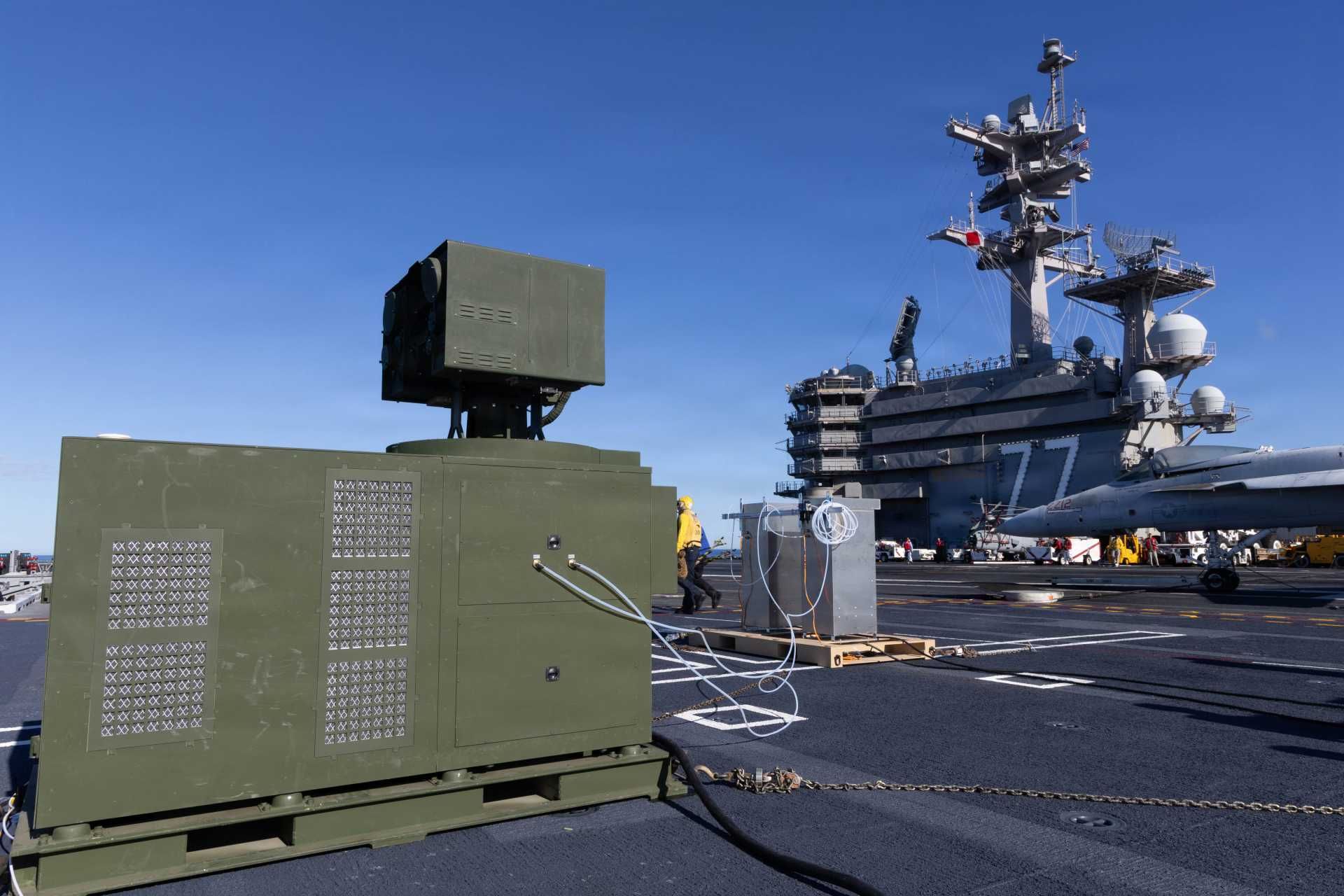 This test represents the first known case of a laser weapon physically mounted and fired from a U.S aircraft carrier, extending prior naval laser testing that had been limited to amphibious ships and destroyers. (Picture source: US Navy)