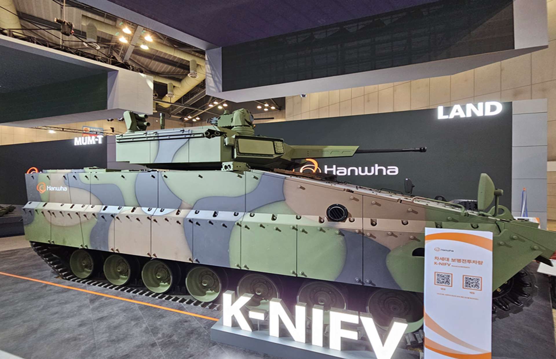 Hanwha’s K-NIFV is a Redback-derived IFV with an unmanned 30 mm turret (ATGM-ready), eight-troop capacity, and layered counter-drone plus APS protection (Picture source: Hanwha Aerospace).