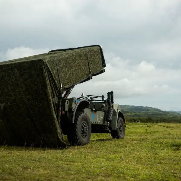 U.S. Marine Corps NMESIS launcher mounted on an unmanned ROGUE-Fires vehicle during a maritime strike exercise, providing long-range anti-ship capabilities from dispersed coastal positions.