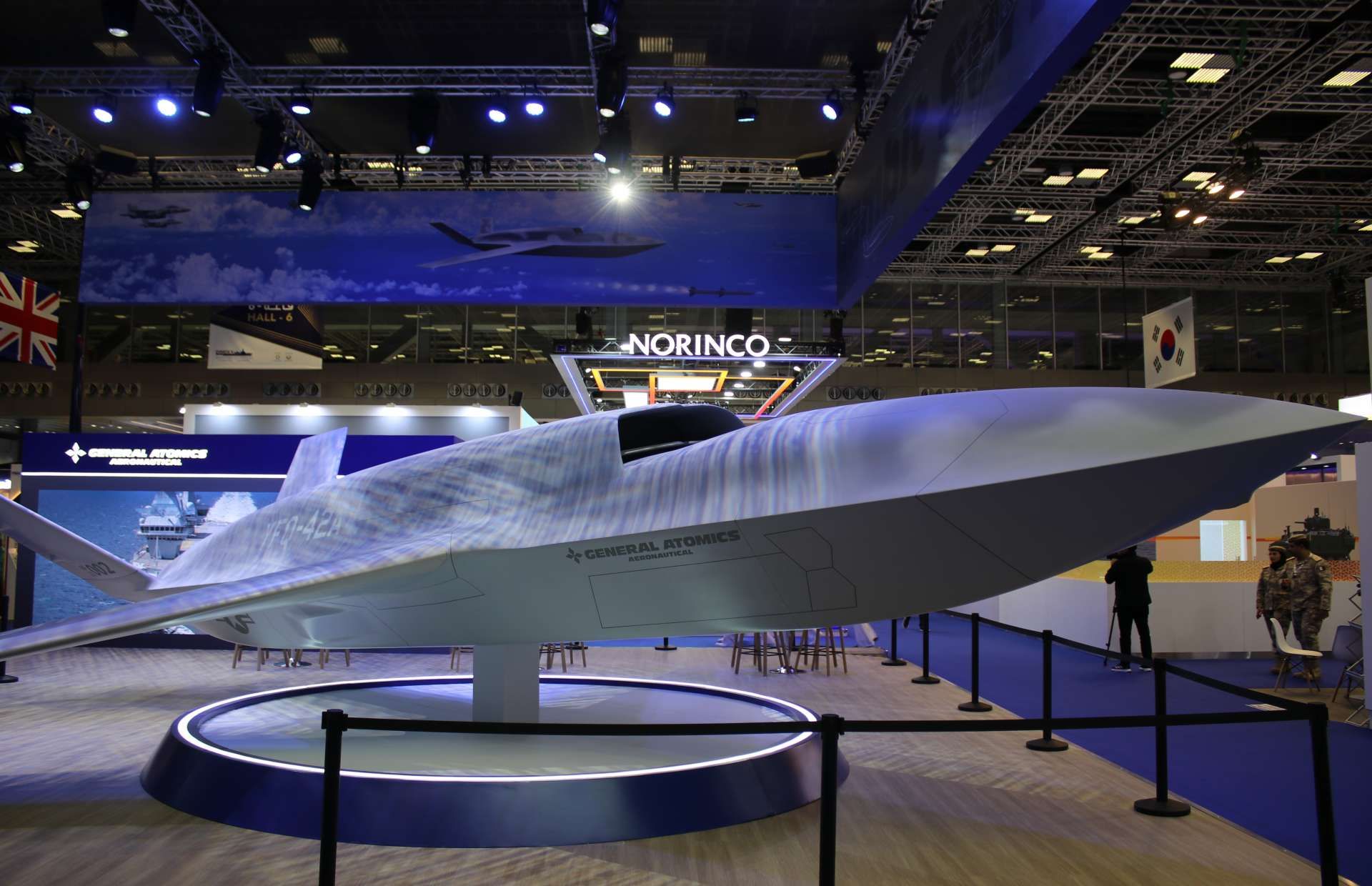 The YFQ-42A uncrewed fighter features an internal weapons bay designed to carry air-to-air missiles such as AIM-120 AMRAAM, enabling it to act as a forward “missile truck” that extends the reach, firepower, and survivability of manned fighters by delivering additional shots deep into contested airspace while reducing risk to human pilots (Picture source: Army Recognition Group).