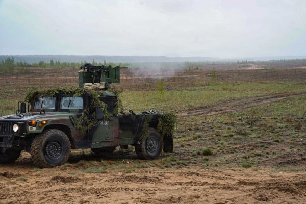 U.S. Army soldiers from the 5th Battalion, 4th Air Defense Artillery Regiment test a modified Humvee equipped with a CROWS remote weapon station and M2 Browning machine gun near Baltadvaris, Lithuania, on May 9, 2026. The improvised Mobile Fire Team vehicle, created by mounting a recycled CROWS turret onto a Humvee, provides a mobile low-cost counter-drone capability as part of NATO’s Eastern Flank Deterrence Initiative.