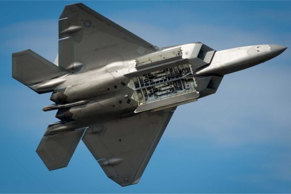 U.S. Air Force F-22 Raptor with its internal weapons bay open, revealing the missile launch system. The AIM-260 Joint Advanced Tactical Missile (JATM) is designed to integrate within the same internal bay, preserving stealth while significantly extending air-to-air engagement range.