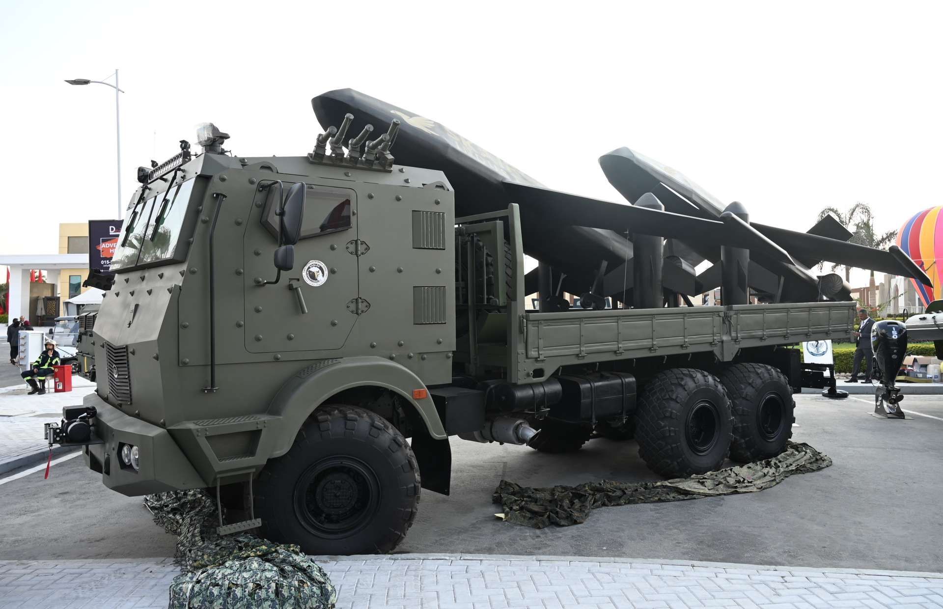 Armored 6x6 mobile UAV launcher featuring BR7 ballistic protection, integrated control station, and multi-rail launch system capable of deploying reconnaissance drones and loitering munitions directly from the vehicle for rapid, concealed, on-the-move operations (Picture source: Army Recognition Group).