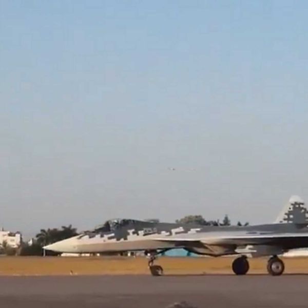 Russian Su-57E fighter jet export variant touching down during a landing demonstration at Aero India 2025, highlighting its advanced airframe and stealth profile.