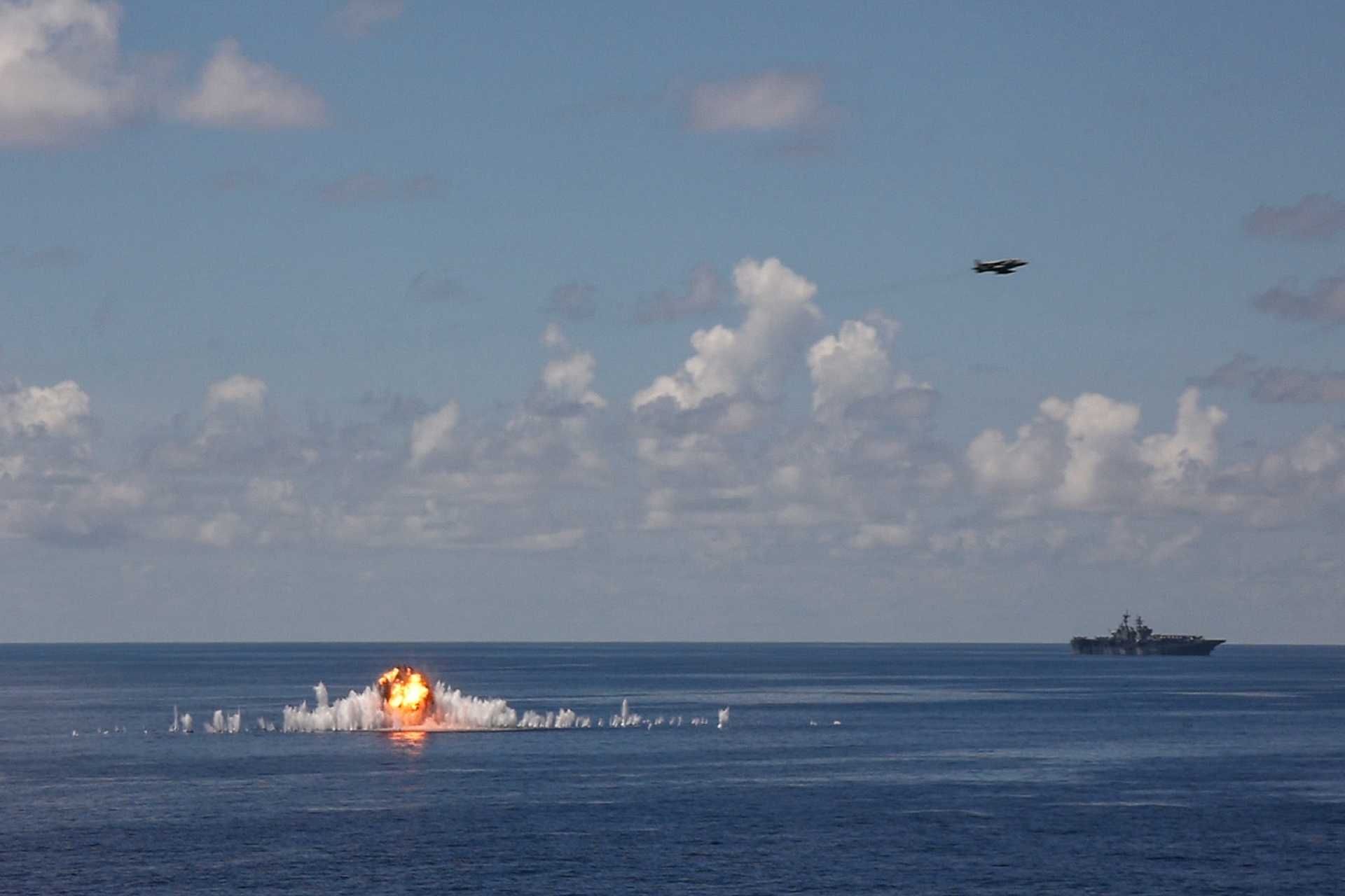 A U.S. Marine Corps AV-8B Harrier II launches from the flight deck of USS Iwo Jima (LHD 7) during a live-fire strike exercise conducted by the 22nd Marine Expeditionary Unit while operating in the Caribbean Sea on October 2, 2025.
