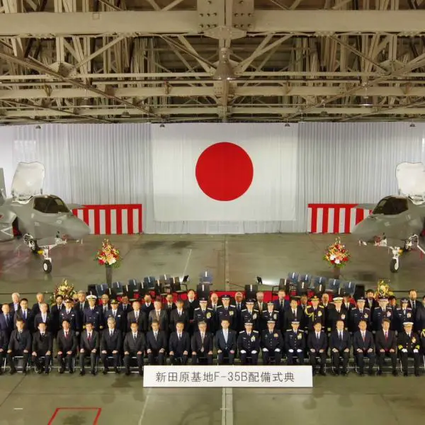 Japanese defense officials and Japan Air Self-Defense Force personnel attend the F-35B deployment commemoration ceremony at Nyutabaru Air Base on February 7, marking the official entry of the STOVL stealth fighter into frontline service.