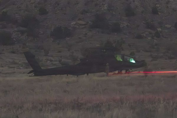 A U.S. Army AH-64 Apache attack helicopter assigned to the 4th Combat Aviation Brigade, 4th Infantry Division, approaches a forward arming and refuel point during Exercise Ivy Mass at Fort Carson, Colorado, on May 12, 2026, as the U.S. Army tests Next-Generation Command and Control capabilities for future large-scale combat operations.