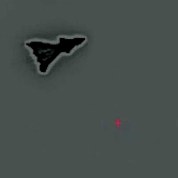 The mysterious aircraft's compact, triangular shape with cranked-kite wings, a sharp nose, possible canards, a sawtooth trailing edge, and no visible vertical tails strongly and strikingly match what is expected of the secretive F-47 fighter. (Picture source: YouTube/Project Fear via X/@OSPSF)