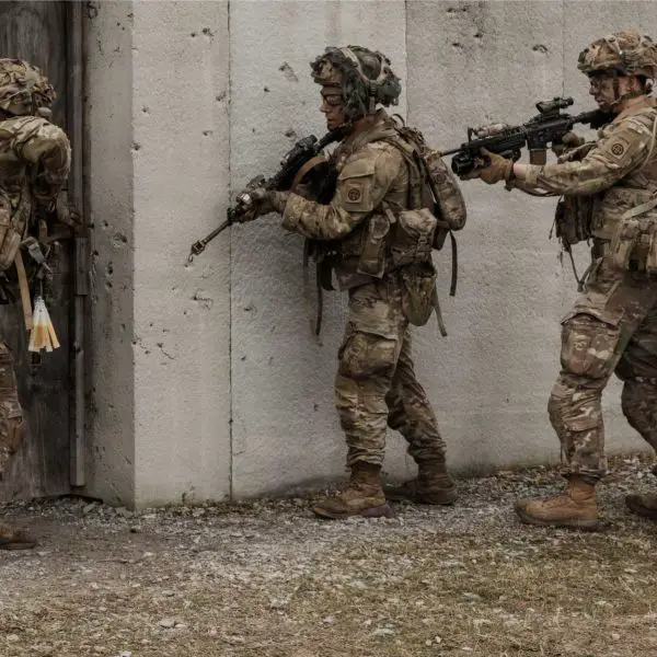 U.S. Army paratroopers assigned to the 3rd Brigade Combat Team, 82nd Airborne Division, conduct close-quarters battle training during a live-fire exercise at the Joint Readiness Training Center, Fort Polk, Louisiana, March 10, 2026, demonstrating rapid-response combat capabilities aligned with potential deployment scenarios supporting Project Freedom and maritime security operations.