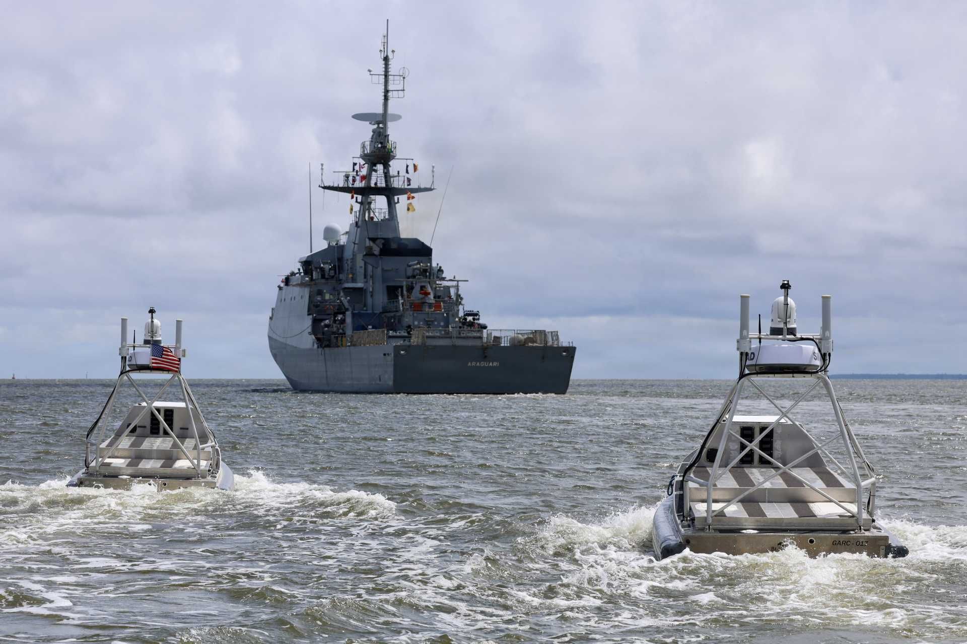 Global Autonomous Reconnaissance Craft (GARC) unmanned surface vessels maneuver alongside the Brazilian Navy Amazonas-class offshore patrol vessel Araguari (P122) during a robotic and autonomous systems demonstration conducted by U.S. Navy Task Force 66 as part of Exercise Obangame Express 2026 in Douala, Cameroon.