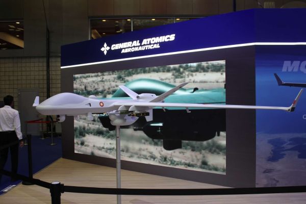 An armed MQ-9B SeaGuardian configured with AGM-114R2 Hellfire missiles and 500-pound precision-guided munitions, illustrating its ability to conduct long-endurance maritime surveillance combined with pinpoint strikes against surface vessels, coastal targets, and time-sensitive threats in contested littoral environments (Picture source: Army Recognition Group).