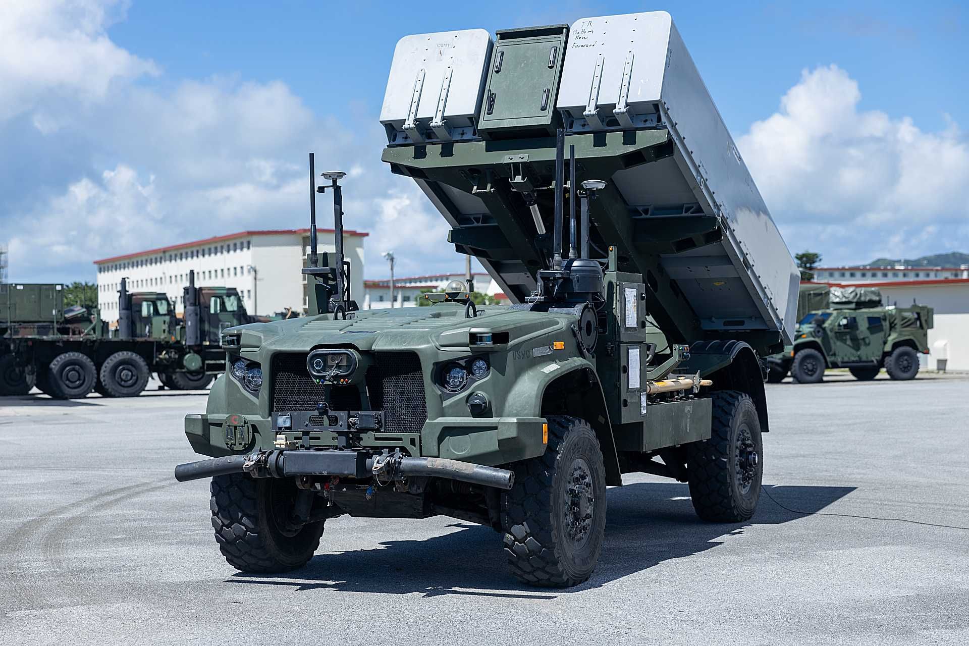 A ROGUE-Fires unmanned ground vehicle of the U.S. Marine Corps configured with a Naval Strike Missile launcher, designed to conduct distributed coastal anti-ship operations under the NMESIS program.