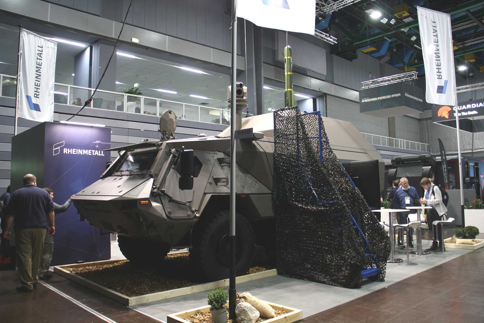 Germany's Rheinmetall Fuchs JAGM armored missile tank destroyer displayed at Enforce Tac 2026 in Germany, showcasing its 24-cell vertical launch system for AGM-179 JAGM and AGM-114L Hellfire missiles integrated on the 6x6 Fuchs armored platform.
