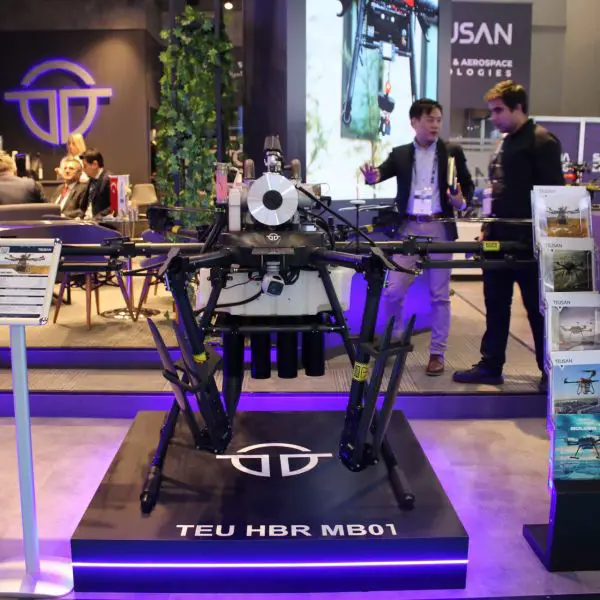 Turkish company TEUSAN displayed the TEU HBR MB01 hybrid multirotor UAV at SAHA 2026, showing a 50 kg payload-class drone with a two-hour endurance and automatic bomb-release mechanism for tactical resupply, surveillance, and controlled munition delivery (Picture source: Army Recognition Group).