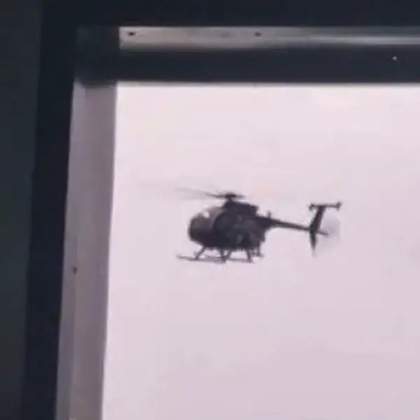 Screenshot from a video filmed by crew members aboard the tanker shows a helicopter approaching the vessel during the U.S. interception operation. (Picture source: X channel @WarMonitor3 )