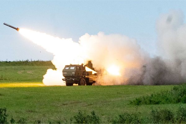 U.S. Army HIMARS launcher executes a precision strike during training, illustrating long-range fire support with GMLRS and future PrSM capability in support of distributed operations in contested environments.