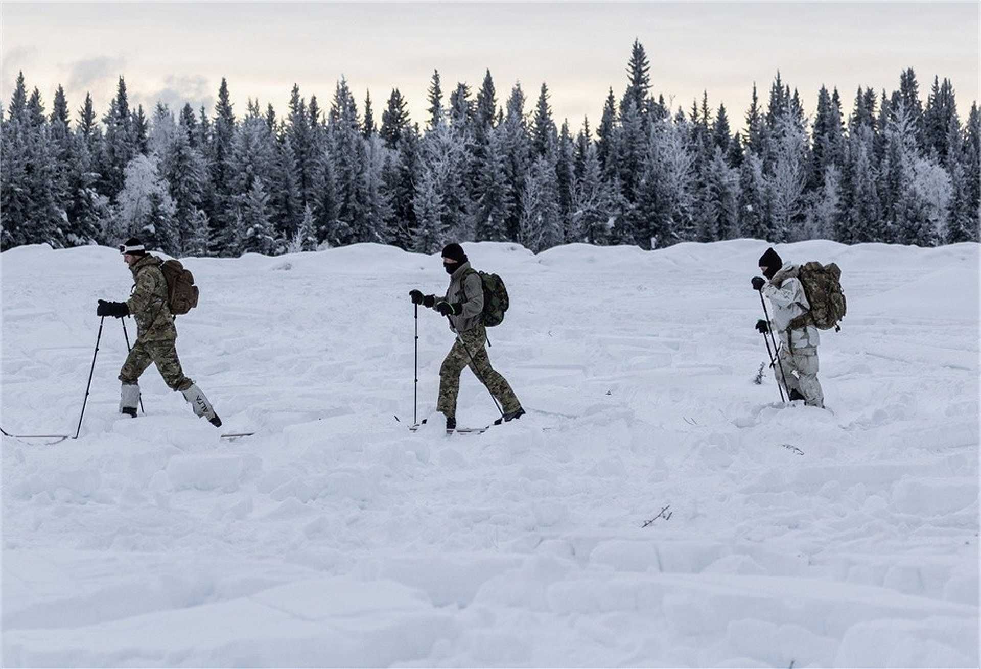 U.S. soldiers from 3rd Battalion, 10th Special Forces Group (Airborne) conduct cross-country ski mobility training across snow-covered terrain during cold weather operations preparation at Fort Wainwright, Alaska, on January 24, 2026, enhancing their ability to maneuver and sustain special operations in Arctic environments.