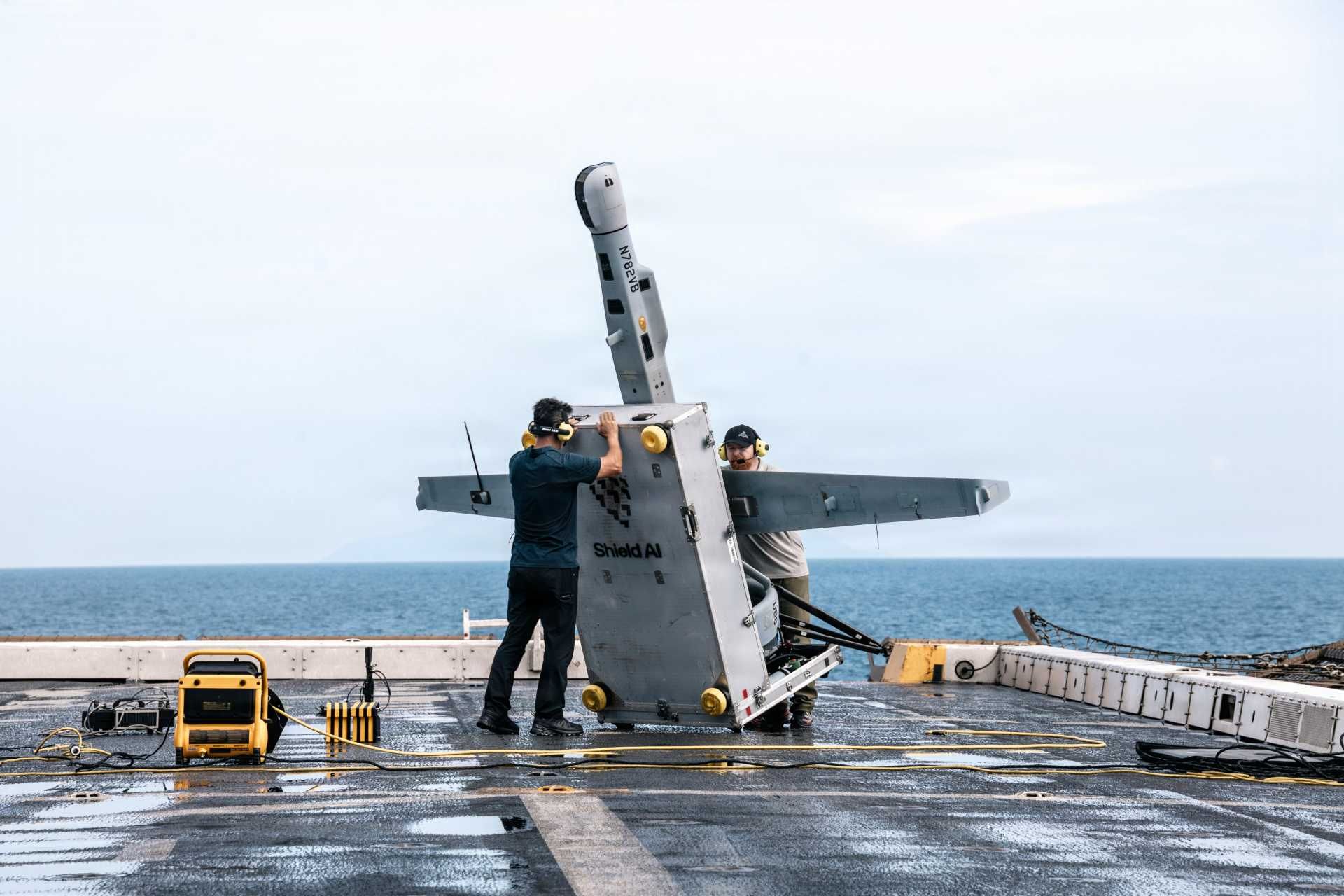 U.S. Department of War contractors prepare a VBAT vertical take-off and landing (VTOL) unmanned aerial system for launch aboard the San Antonio-class amphibious transport dock ship USS Portland (LPD 27) during operations in the Pacific Ocean on June 9, 2026. (Picture source: U.S. DoD)