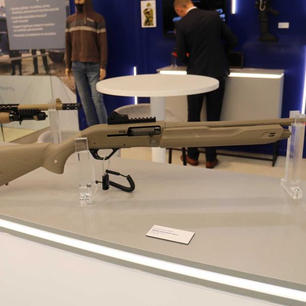 The FN Herstal SX4™ semi-automatic shotgun in its tactical configuration on display at Milipol 2025, optimized for short-range counter-drone operations with red dot optic compatibility and mission-adapted ammunition.