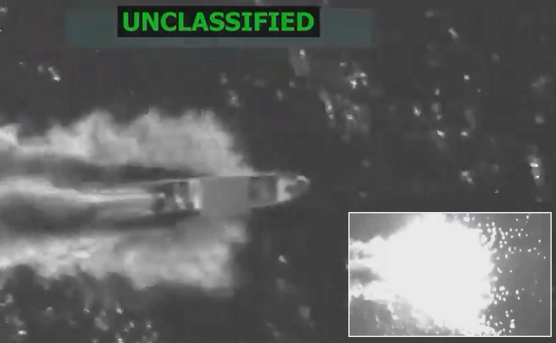 Still from U.S. Department of War-released footage shows the moment of impact as a precision-guided munition strikes a suspected drug trafficking vessel in the eastern Pacific, October 23, 2025.