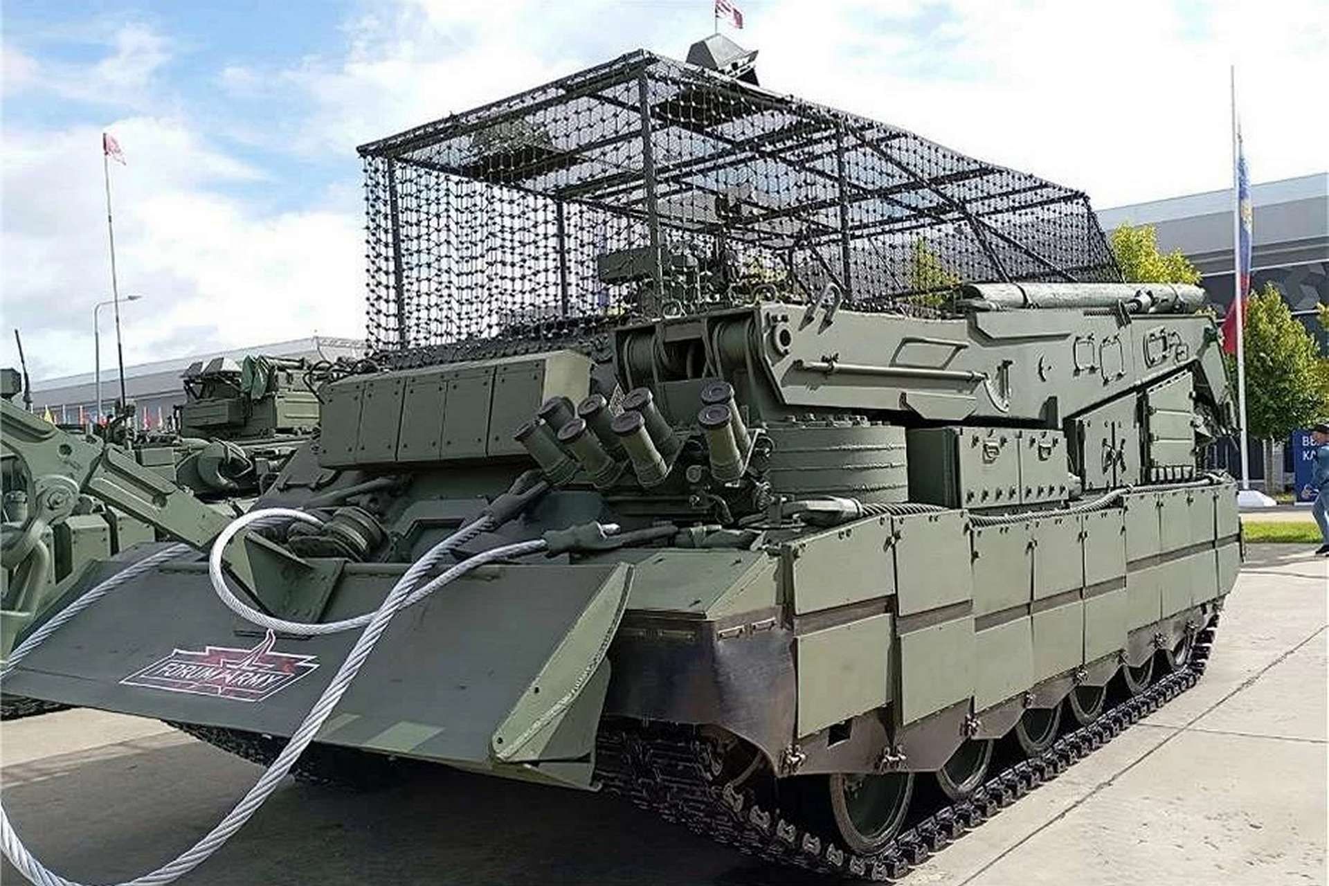 Modernized BREM-80 T-80-based armored recovery vehicle with heavy winches, 18-ton-class crane, dozer-spade anchor, and mechanized coupling for rapid under-armor towing and extraction under drone and artillery threat (Picture source: Army Recognition Group).