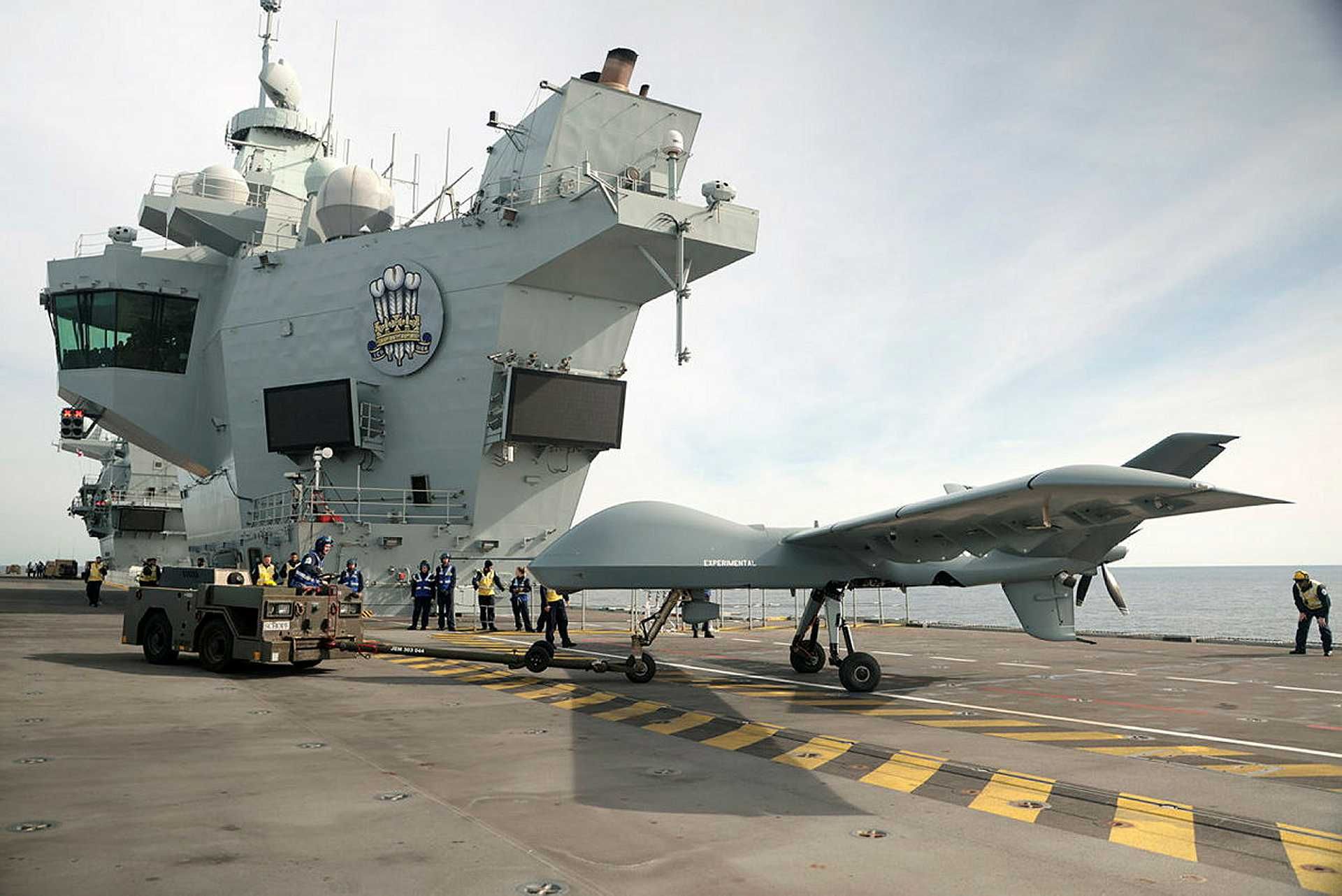 Mojave STOL unmanned aerial vehicle pictured on the flight deck of the Royal Navy aircraft carrier HMS Prince of Wales during a landmark trial on November 15, 2023. During the demonstration conducted off the U.S. East Coast, the remotely piloted aircraft successfully executed a short takeoff, deck circuits, and a full recovery landing, marking the first time a UAS of its class operated from an aircraft carrier.