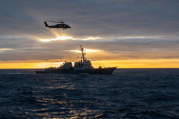An MH-60S Sea Hawk conducts vertical replenishment near the Arleigh Burke-class destroyer USS Gridley and aircraft carrier USS Nimitz during Southern Seas 2026, demonstrating the U.S. Navy’s ability to sustain carrier strike group operations, preserve combat readiness, and strengthen maritime interoperability in the Pacific (Picture source: U.S. DoW).