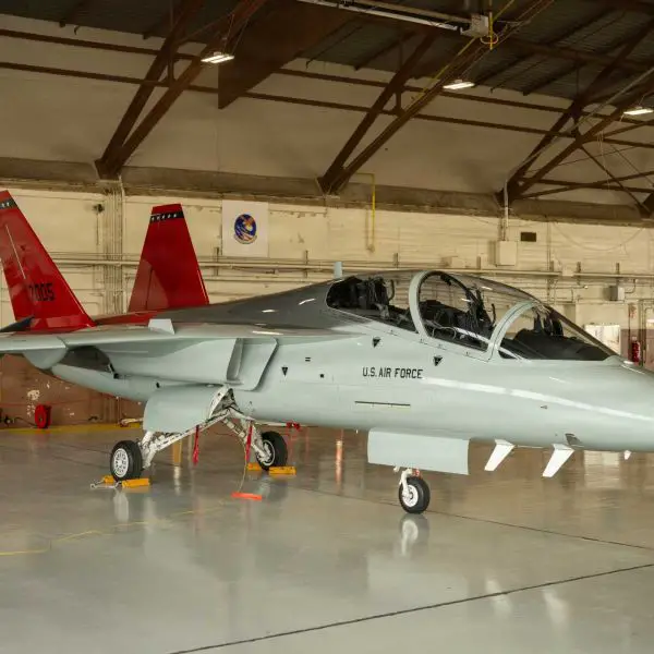 Under the wing of a T-7A Red Hawk inside a U.S. Air Force hangar, new training technologies by Textron Systems aim to equip maintainers with real-world system experience