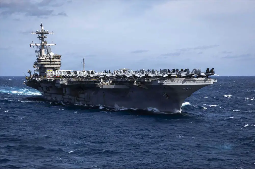 USS George H.W. Bush (CVN-77), a Nimitz-class nuclear-powered aircraft carrier of the U.S. Navy, sails during operations at sea. The carrier is preparing for potential deployment to the Middle East as part of a Carrier Strike Group reinforcing U.S. naval presence near Iran.