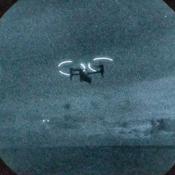 Night-vision view of a U.S. Marine Corps MV-22B Osprey conducting night flight operations from USS Iwo Jima in the Caribbean Sea